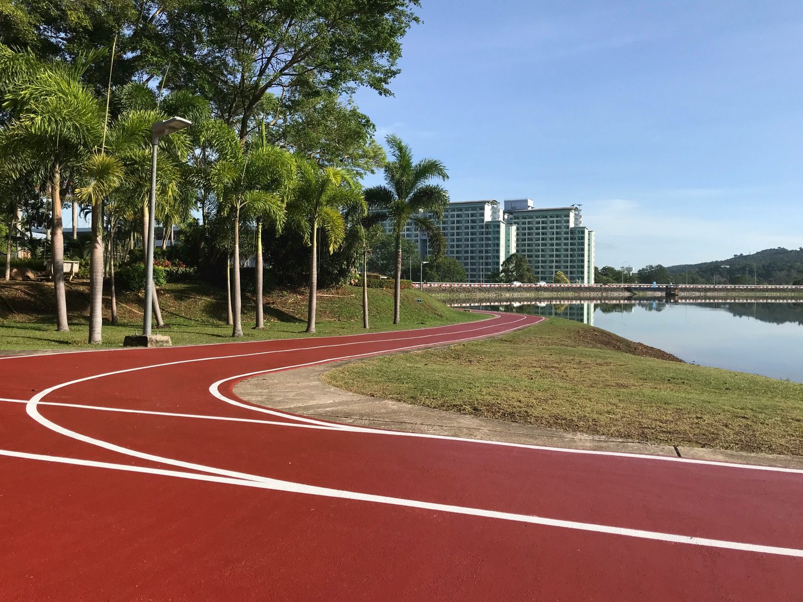 a view of a running track next to a body of water